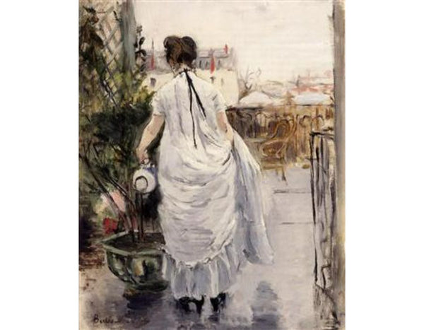 Young Woman Watering A Shrub