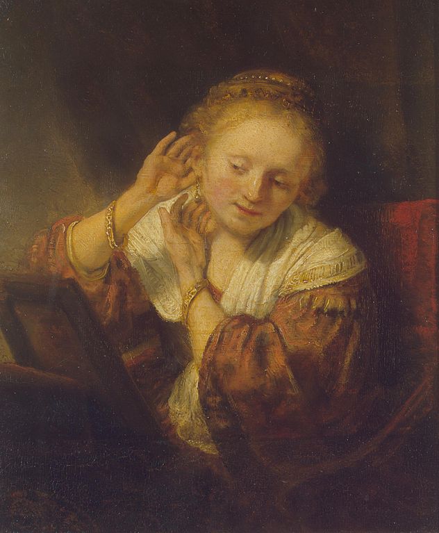 A Young Woman Trying on Earings 