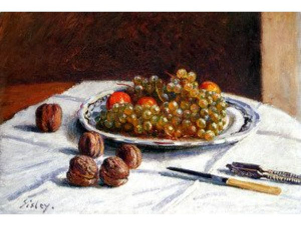 Grapes And Walnuts On A Table